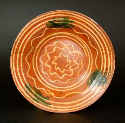 Redware Bowl with Elaborate Yellow Slip-Decorated Interior and Green Sponging