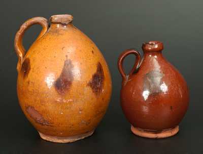 Lot of Two: Ovoid Redware Jugs with Manganese Decoration