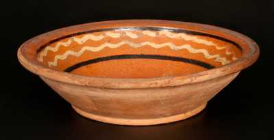 Redware Bowl with Yellow and Brown Slip-Decorated Interior