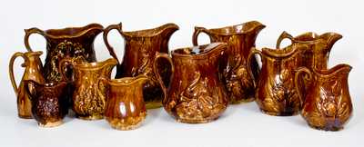 Lot of Eleven: American Rockingham Ware Pitchers in Various Patterns