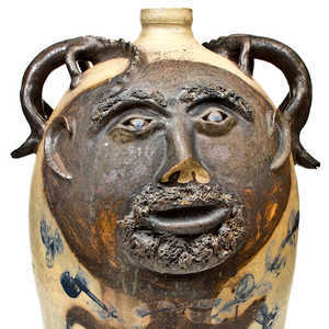 Exceedingly Rare and Important Twenty-Gallon Stoneware Face Water Cooler