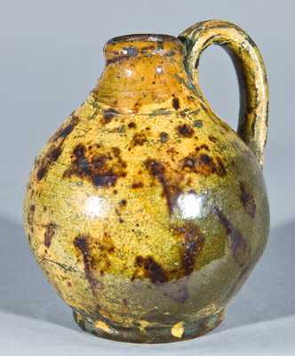 Miniature Glazed Redware Jug, New England origin.