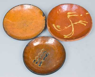 Three Glazed Redware Plates, PA or New England origin.