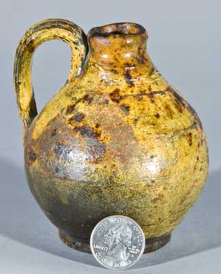 Miniature Glazed Redware Jug, New England origin.