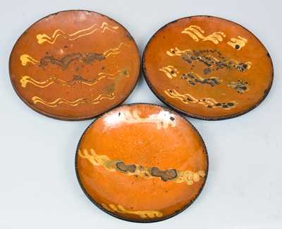 Three Redware Plates, PA or New England origin.