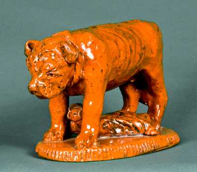 Redware Figure of a Dog Guarding a Baby