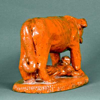 Redware Figure of a Dog Guarding a Baby