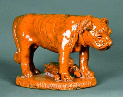 Redware Figure of a Dog Guarding a Baby