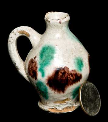 Miniature Redware Jug with Multi-Colored Glaze