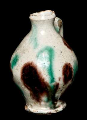 Miniature Redware Jug with Multi-Colored Glaze