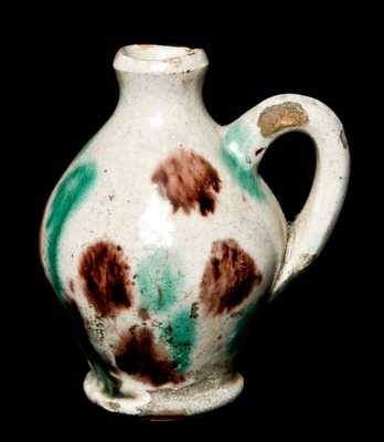 Miniature Redware Jug with Multi-Colored Glaze