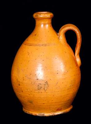 Orange Ovoid Redware Jug