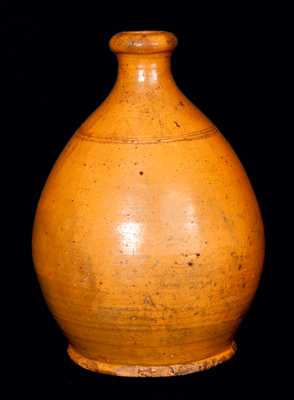 Orange Ovoid Redware Jug