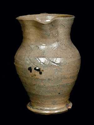 Unusual Footed Stoneware Pitcher with Incised Lines, North Carolina Origin