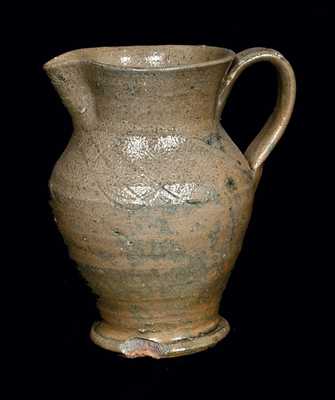 Unusual Footed Stoneware Pitcher with Incised Lines, North Carolina Origin