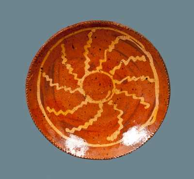 Redware Plate with Slip-Decorated Wheel Decoration
