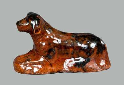 Miniature Molded Redware Toy Reclining Dog with Manganese Highlights