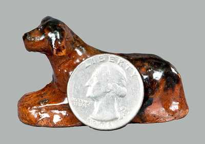 Miniature Molded Redware Toy Reclining Dog with Manganese Highlights