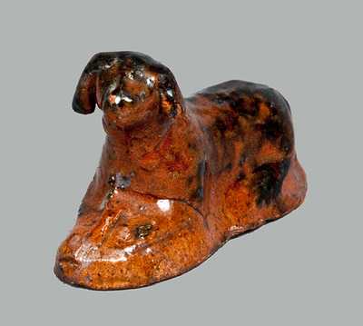 Miniature Molded Redware Toy Reclining Dog with Manganese Highlights