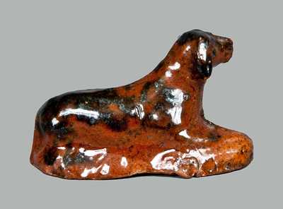 Miniature Molded Redware Toy Reclining Dog with Manganese Highlights