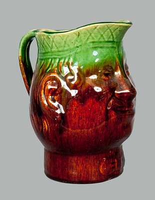 Face Pitcher with Rockingham Type Glaze