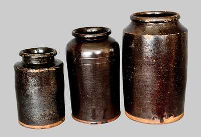 Lot of Three: Cylindrical Redware Jars with Manganese Glaze