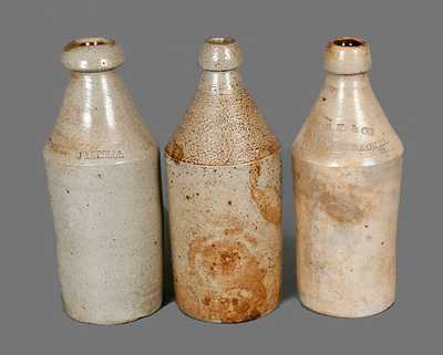 Lot of Three: Stoneware Bottles with Impressed Advertising