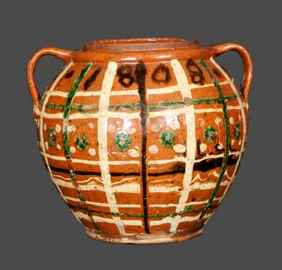 Outstanding Ovoid Redware Jar Dated 1808 and Decorated with Green, Brown and Yellow Slip