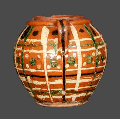 Outstanding Ovoid Redware Jar Dated 1808 and Decorated with Green, Brown and Yellow Slip