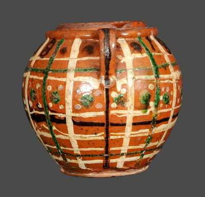 Outstanding Ovoid Redware Jar Dated 1808 and Decorated with Green, Brown and Yellow Slip