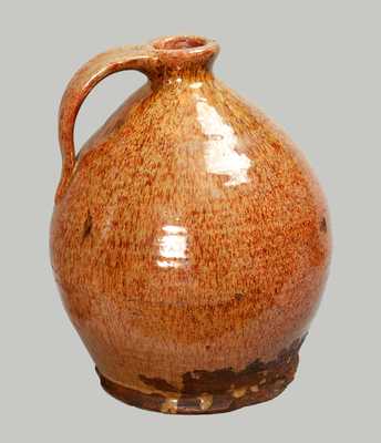 Exceptional Glazed Redware Jug, New England origin, probably Maine, early 19th century.