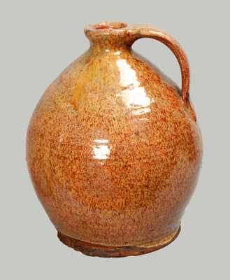 Exceptional Glazed Redware Jug, New England origin, probably Maine, early 19th century.