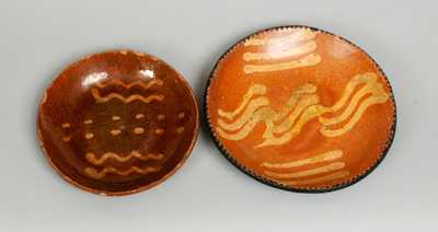 Two Slip-Decorated Redware Plates, American, 19th century.