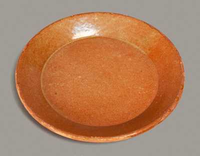 Glazed Redware Plate, New England origin, 19th century.