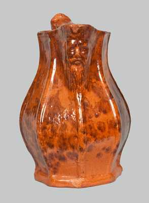 Unusual Redware Pitcher with Molded-Face Spout