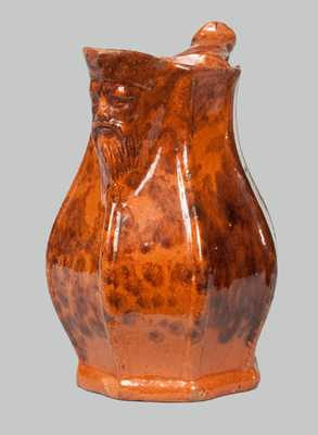 Unusual Redware Pitcher with Molded-Face Spout