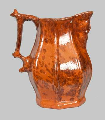 Unusual Redware Pitcher with Molded-Face Spout