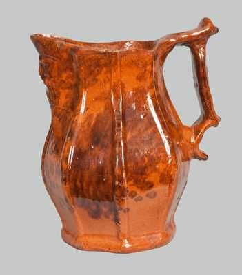 Unusual Redware Pitcher with Molded-Face Spout