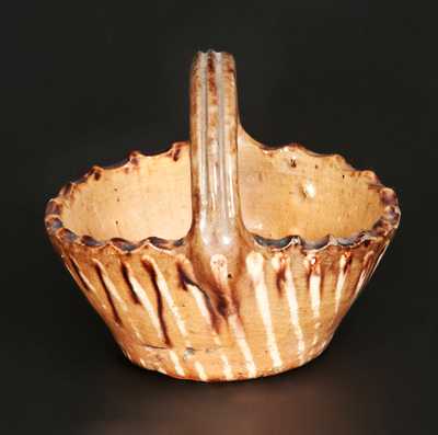 Rare Miniature Slip-Decorated Redware Basket, probably Pennsylvania origin, 19th century.