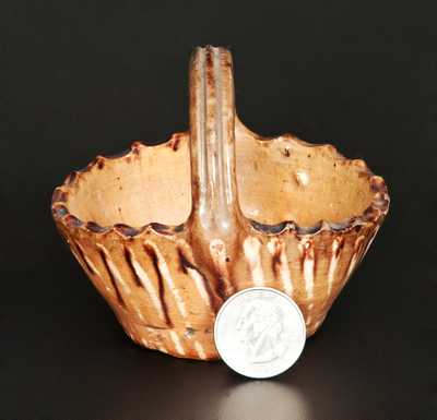 Rare Miniature Slip-Decorated Redware Basket, probably Pennsylvania origin, 19th century.