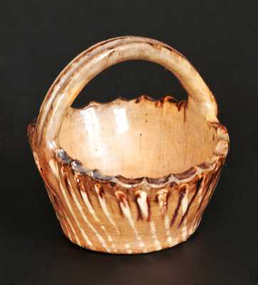 Rare Miniature Slip-Decorated Redware Basket, probably Pennsylvania origin, 19th century.