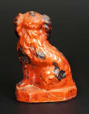 Glazed Redware Figure of a Spaniel, Pennsylvania origin, second half 19th century.