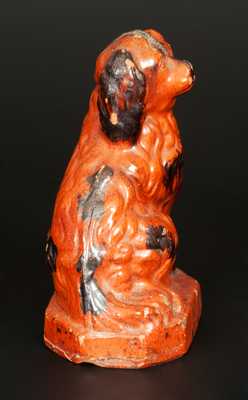 Glazed Redware Figure of a Spaniel, Pennsylvania origin, second half 19th century.