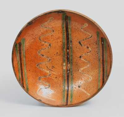 Berks County, PA Redware Plate with Three-Color Slip Decoration, second half 19th century