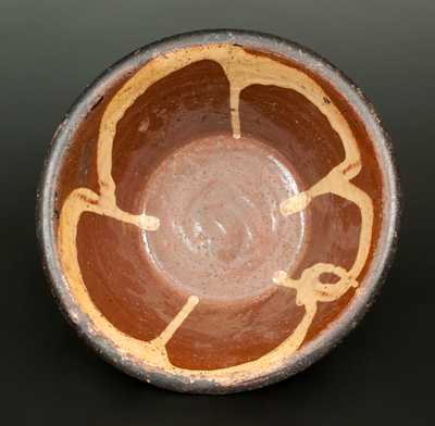 Redware Bowl with Yellow Slip Streaked Interior