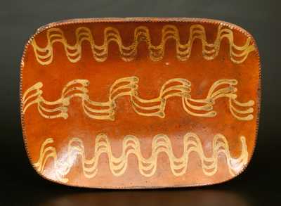 Large Redware Loaf Dish with Profuse Yellow Slip Decoration