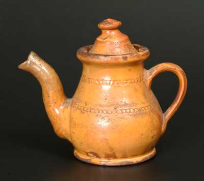 Unusual Redware Teapot with Coggled Decoration and Orange Slip Coating