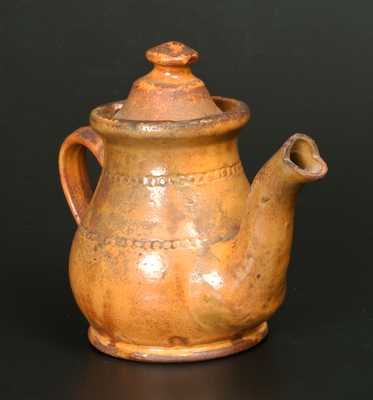 Unusual Redware Teapot with Coggled Decoration and Orange Slip Coating