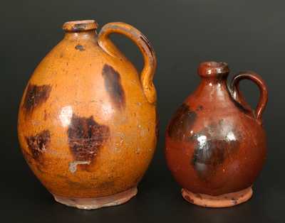 Lot of Two: Ovoid Redware Jugs with Manganese Decoration