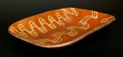 Large Redware Loaf Dish with Profuse Yellow Slip Decoration